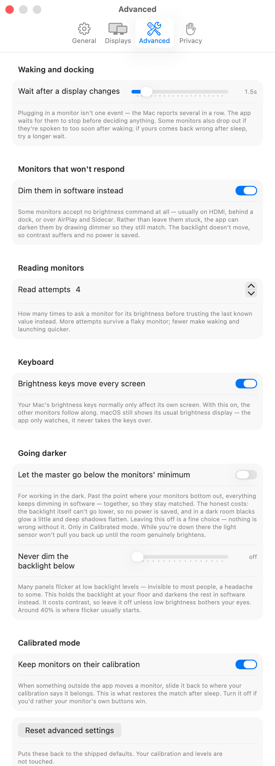 The Advanced tab in full: wake timing for displays that ignore brightness commands after sleep, software dimming for monitors that never accept them, how many times to re-read a monitor, keyboard shortcuts, dimming below the hardware floor, and the reset controls at the bottom